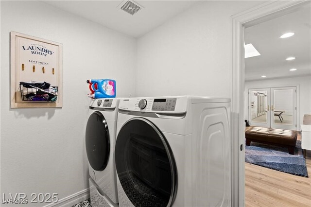 3108 Sonia Dr, Las Vegas, NV 89107 - washroom featuring washer and dryer, wood finished floors, and recessed lighting