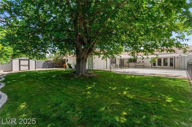 3108 Sonia Dr, Las Vegas, NV 89107 - view of yard featuring a storage shed, a patio, and french doors