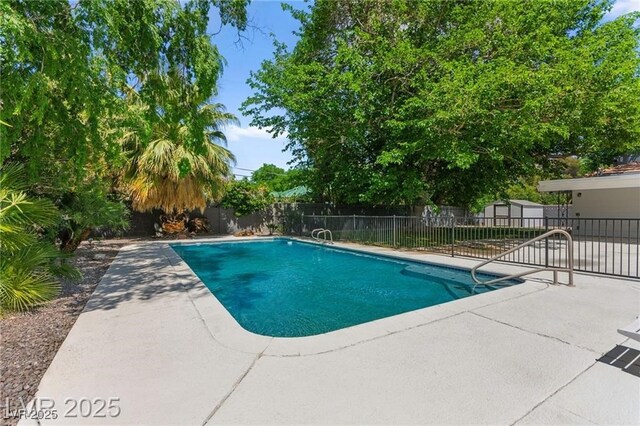 3108 Sonia Dr, Las Vegas, NV 89107 - view of pool featuring a patio area, a fenced backyard, and a storage shed