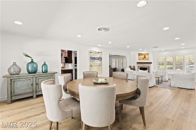 3108 Sonia Dr, Las Vegas, NV 89107 - dining space featuring recessed lighting, a fireplace, and light wood finished floors