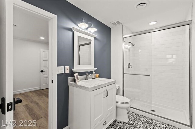 3108 Sonia Dr, Las Vegas, NV 89107 - full bathroom featuring a stall shower, vanity, recessed lighting, and wood finished floors