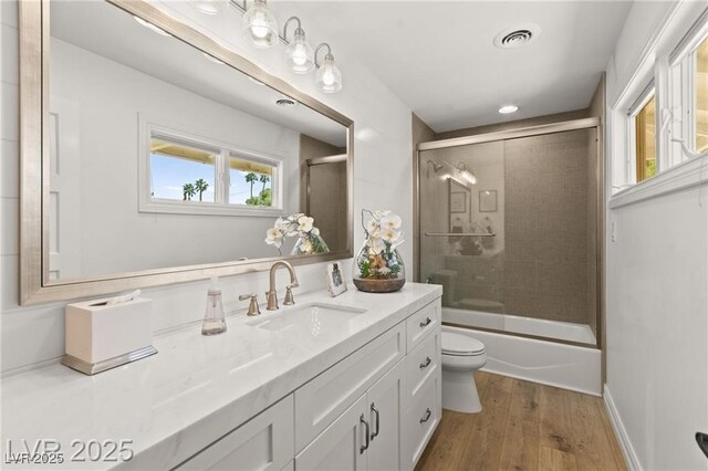 3108 Sonia Dr, Las Vegas, NV 89107 - bathroom with vanity, wood finished floors, and enclosed tub / shower combo