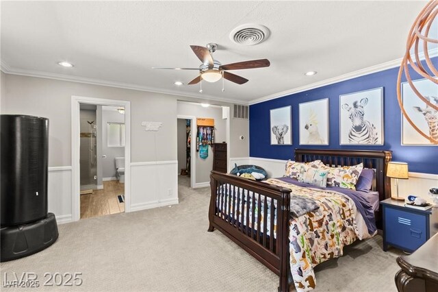 3108 Sonia Dr, Las Vegas, NV 89107 - carpeted bedroom with crown molding, recessed lighting, wainscoting, a ceiling fan, and ensuite bath