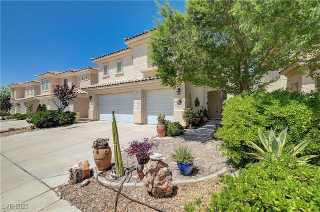 3873 Palm Island Ct, Las Vegas, NV 89147 - mediterranean / spanish-style home with stucco siding, a garage, concrete driveway, and a tiled roof