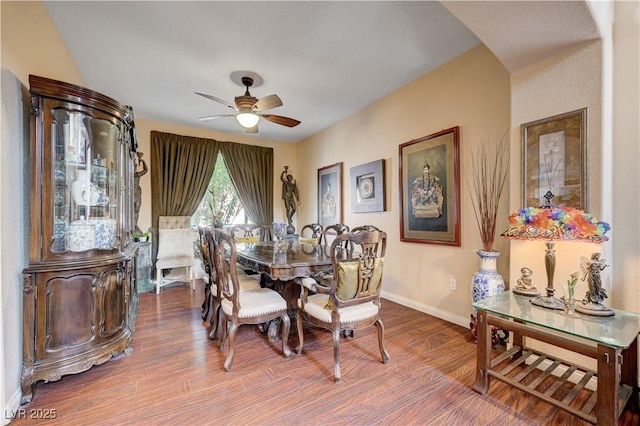 3873 Palm Island Ct, Las Vegas, NV 89147 - dining area with a ceiling fan, wood finished floors, and arched walkways