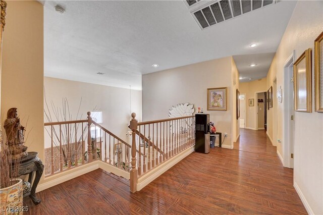 3873 Palm Island Ct, Las Vegas, NV 89147 - hall featuring an upstairs landing, wood finished floors, and recessed lighting