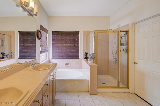 3873 Palm Island Ct, Las Vegas, NV 89147 - bathroom with tile patterned floors, a garden tub, a shower stall, and double vanity