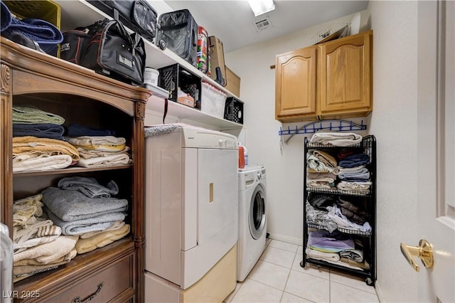 3873 Palm Island Ct, Las Vegas, NV 89147 - washroom with washing machine and dryer, light tile patterned flooring, and cabinet space