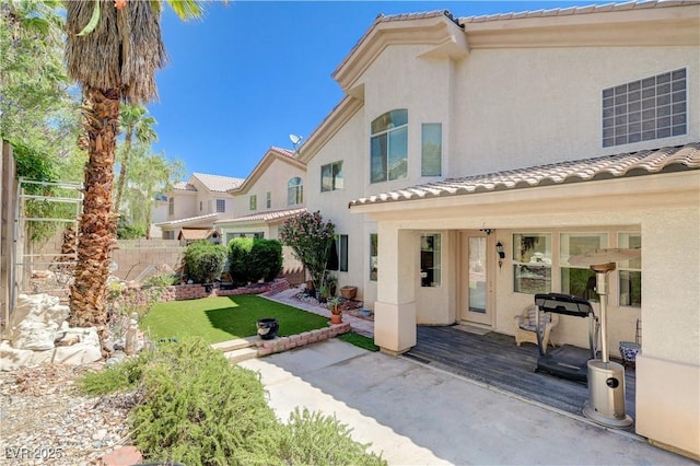 3873 Palm Island Ct, Las Vegas, NV 89147 - back of property with a tiled roof, stucco siding, and a patio