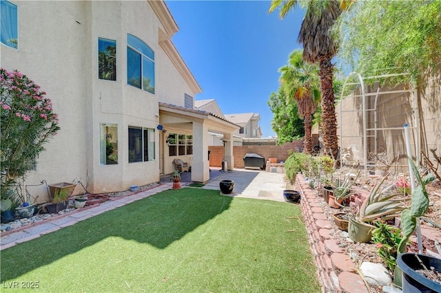 3873 Palm Island Ct, Las Vegas, NV 89147 - fenced backyard with a patio area