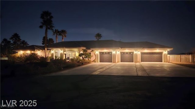8290 Gagnier Blvd, Las Vegas, NV 89113 - view of front facade with a garage and driveway