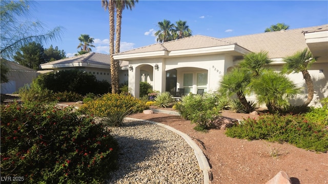 8290 Gagnier Blvd, Las Vegas, NV 89113 - rear view of property featuring covered porch and stucco siding