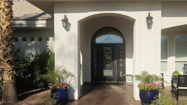 8290 Gagnier Blvd, Las Vegas, NV 89113 - doorway to property with stucco siding