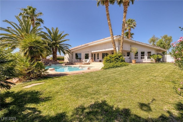 8290 Gagnier Blvd, Las Vegas, NV 89113 - rear view of property with a yard, an outdoor pool, a patio area, and stucco siding