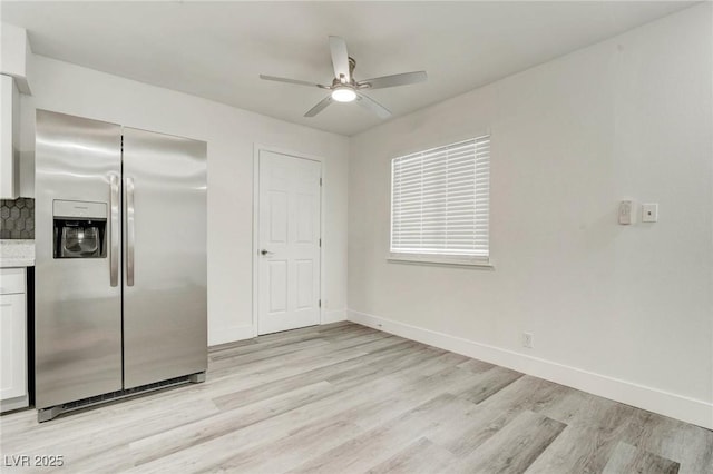 4432 Ash Ave, Las Vegas, NV 89110 - kitchen with stainless steel fridge with ice dispenser, light wood-style floors, ceiling fan, and light countertops