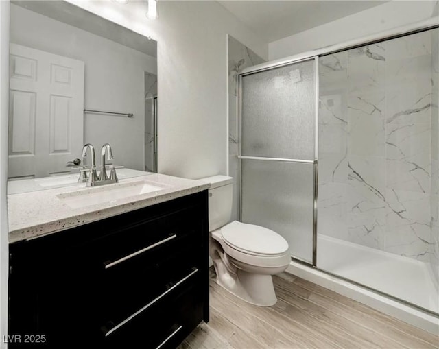 4432 Ash Ave, Las Vegas, NV 89110 - bathroom featuring vanity, a marble finish shower, and wood finished floors