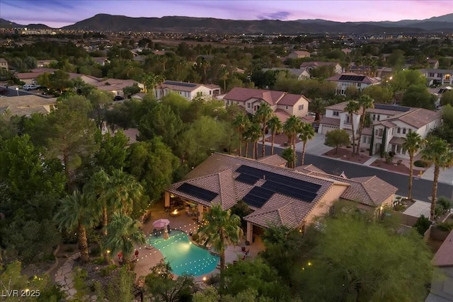 10674 Chillingham Dr, Las Vegas, NV 89183 - aerial view at dusk of a mountain view and view of pool area