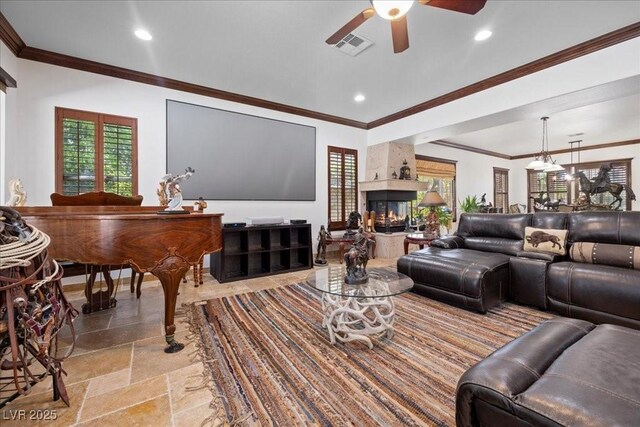 10674 Chillingham Dr, Las Vegas, NV 89183 - living room featuring a ceiling fan, recessed lighting, a high end fireplace, light stone finish floors, and ornamental molding