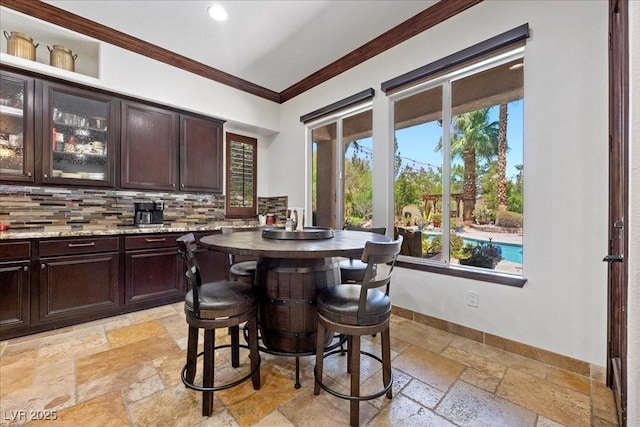 10674 Chillingham Dr, Las Vegas, NV 89183 - dining area with stone tile flooring, ornamental molding, and recessed lighting