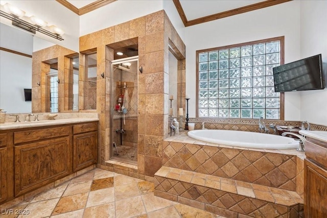10674 Chillingham Dr, Las Vegas, NV 89183 - bathroom with crown molding, a bath, vanity, and a stall shower