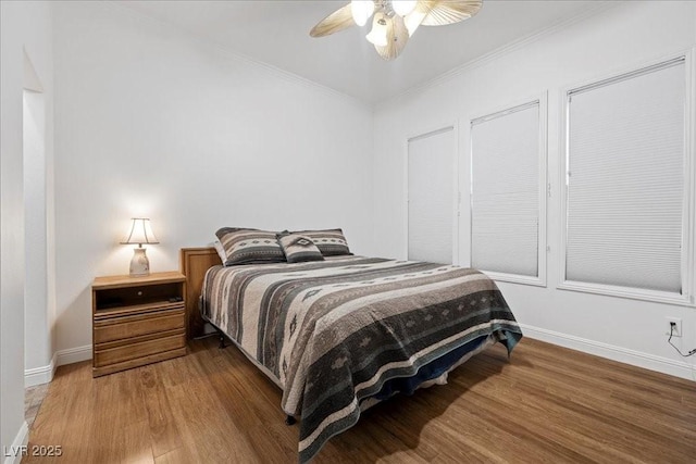 10674 Chillingham Dr, Las Vegas, NV 89183 - bedroom with wood finished floors, ornamental molding, and ceiling fan
