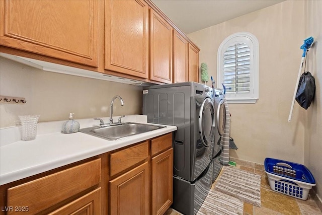 10674 Chillingham Dr, Las Vegas, NV 89183 - laundry room with cabinet space, washer and dryer, and light tile patterned floors