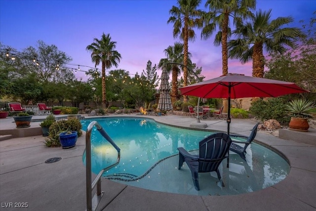 10674 Chillingham Dr, Las Vegas, NV 89183 - pool at dusk with a patio area