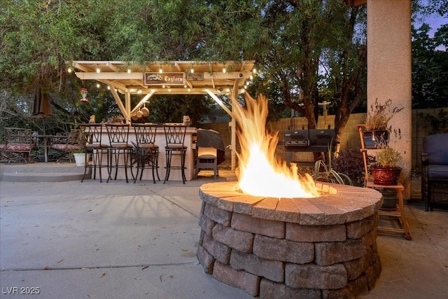 10674 Chillingham Dr, Las Vegas, NV 89183 - view of patio featuring an outdoor fire pit and a pergola