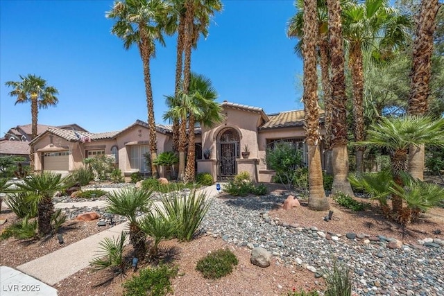 10674 Chillingham Dr, Las Vegas, NV 89183 - mediterranean / spanish home with a garage, stucco siding, and a tile roof