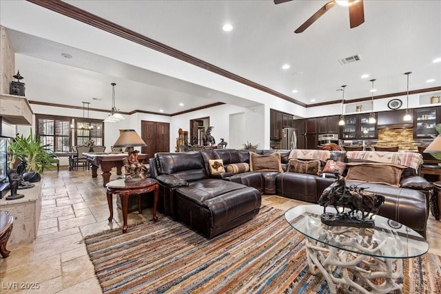 10674 Chillingham Dr, Las Vegas, NV 89183 - living area with stone tile floors, recessed lighting, ceiling fan, and ornamental molding
