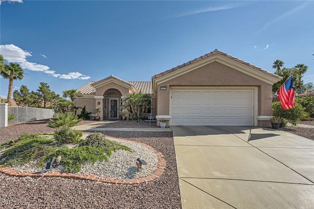 2401 Ocean Edge Ct, Las Vegas, NV 89134 - view of front facade with stucco siding, concrete driveway, a tiled roof, and a garage