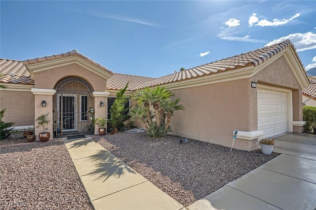 2401 Ocean Edge Ct, Las Vegas, NV 89134 - view of front of house featuring a garage, a tile roof, stucco siding, and driveway