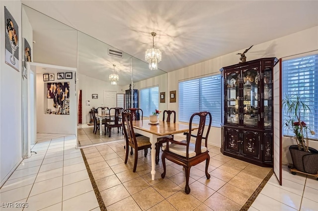 2401 Ocean Edge Ct, Las Vegas, NV 89134 - dining space with a chandelier, light tile patterned flooring, and inlaid floor details