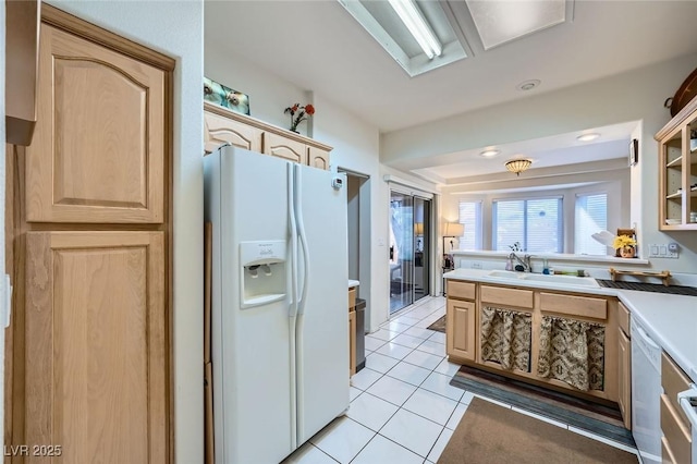 2401 Ocean Edge Ct, Las Vegas, NV 89134 - kitchen featuring white appliances, light brown cabinets, light countertops, and light tile patterned floors