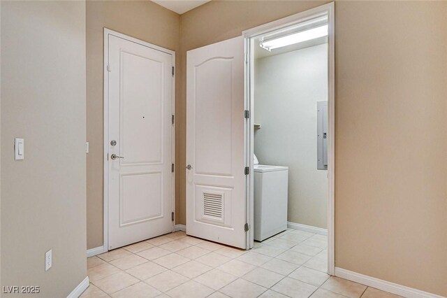 32 E Serene Ave Unit 207, Las Vegas, NV 89123 - washroom with washer / dryer, light tile patterned flooring, and electric panel