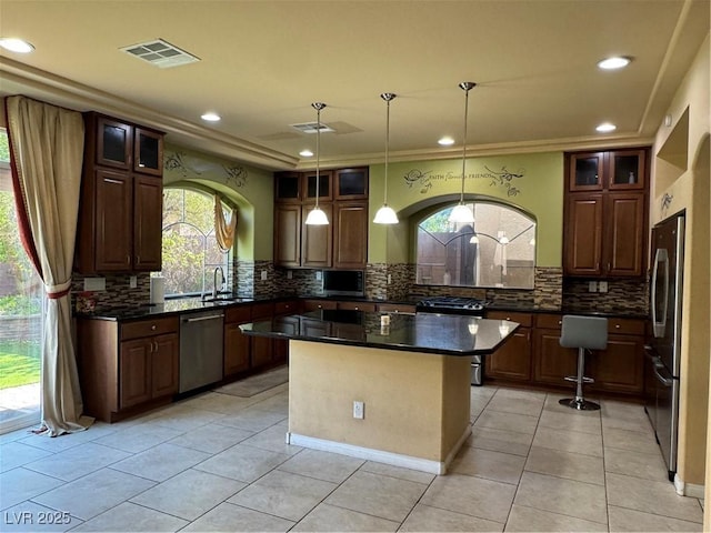 6277 Mustang Spring Ave, Las Vegas, NV 89139 - kitchen featuring stainless steel appliances, backsplash, light tile patterned flooring, a center island, and recessed lighting