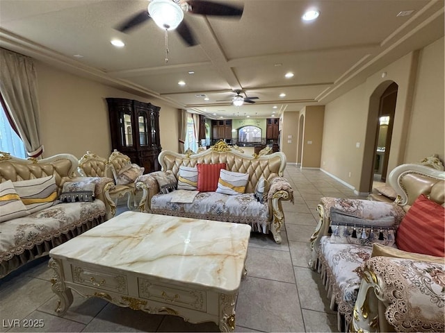 6277 Mustang Spring Ave, Las Vegas, NV 89139 - living room with ceiling fan, arched walkways, recessed lighting, coffered ceiling, and light tile patterned floors