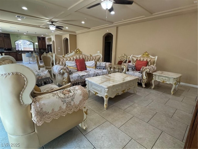 6277 Mustang Spring Ave, Las Vegas, NV 89139 - living area with arched walkways, ceiling fan, coffered ceiling, recessed lighting, and light tile patterned floors