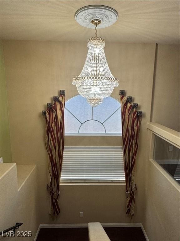 6277 Mustang Spring Ave, Las Vegas, NV 89139 - detailed view of a chandelier and baseboards
