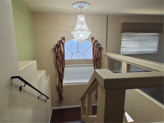 6277 Mustang Spring Ave, Las Vegas, NV 89139 - stairs with a chandelier and baseboards