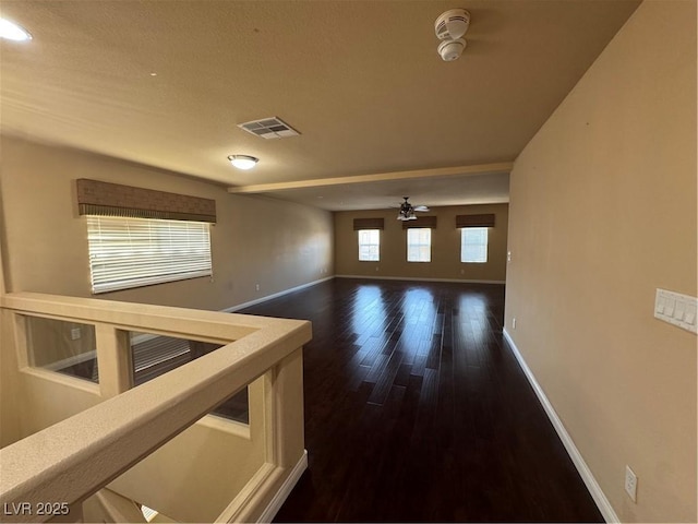 6277 Mustang Spring Ave, Las Vegas, NV 89139 - unfurnished room with a ceiling fan and dark wood finished floors