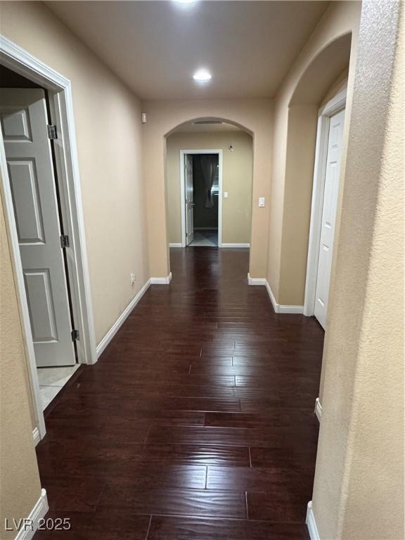 6277 Mustang Spring Ave, Las Vegas, NV 89139 - hallway featuring arched walkways, hardwood / wood-style floors, and recessed lighting