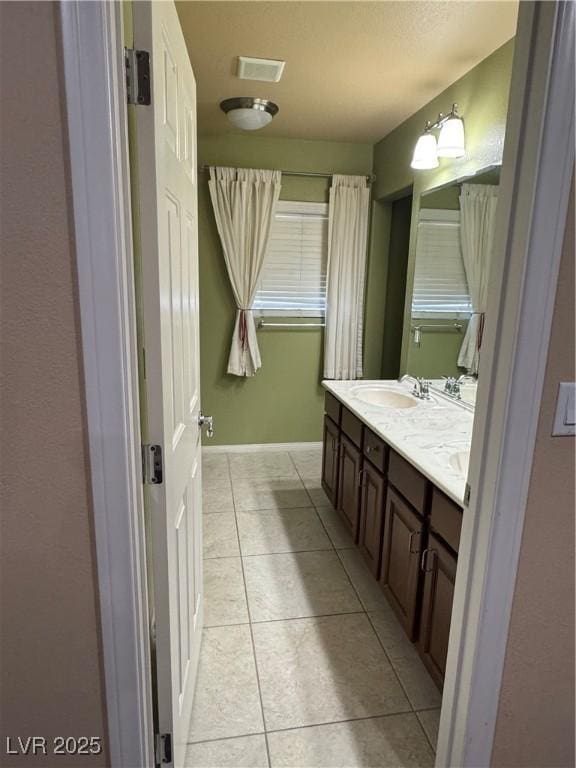 6277 Mustang Spring Ave, Las Vegas, NV 89139 - bathroom with double vanity and tile patterned floors