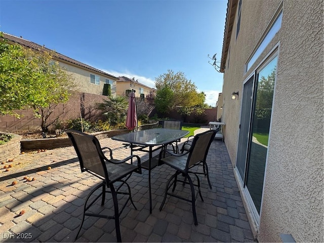 6277 Mustang Spring Ave, Las Vegas, NV 89139 - fenced backyard featuring a patio and outdoor dining area
