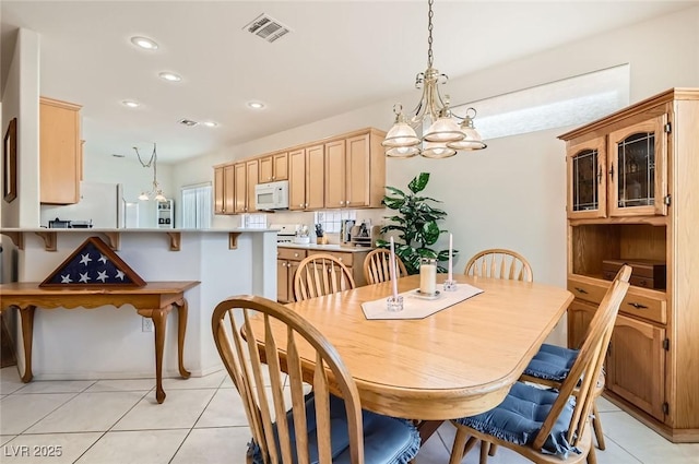 1816 Eagle Mesa Ave, Henderson, NV 89012 - dining space featuring light tile patterned floors, a chandelier, and recessed lighting