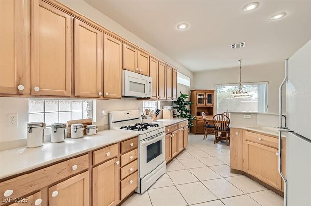 1816 Eagle Mesa Ave, Henderson, NV 89012 - kitchen featuring white appliances, light brown cabinets, recessed lighting, light tile patterned floors, and light countertops