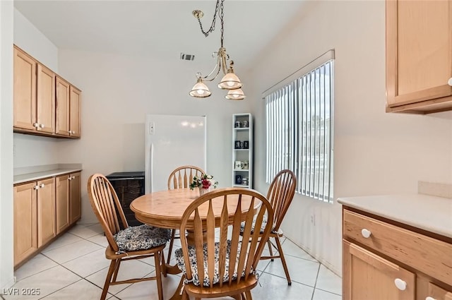 1816 Eagle Mesa Ave, Henderson, NV 89012 - dining room with light tile patterned floors and a chandelier