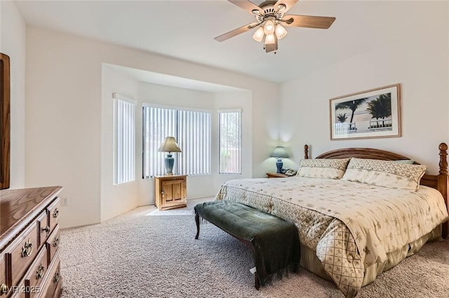1816 Eagle Mesa Ave, Henderson, NV 89012 - bedroom with light colored carpet, multiple windows, and a ceiling fan