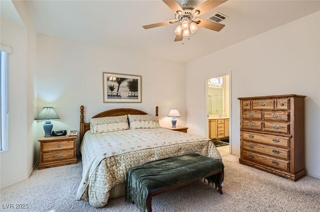 1816 Eagle Mesa Ave, Henderson, NV 89012 - bedroom featuring light colored carpet, connected bathroom, and a ceiling fan