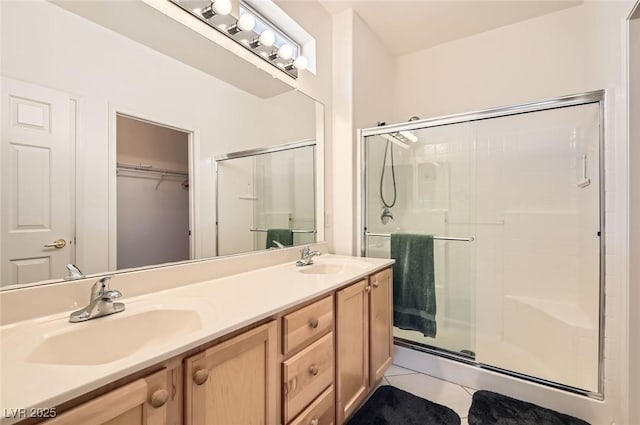 1816 Eagle Mesa Ave, Henderson, NV 89012 - full bath with a shower stall, double vanity, tile patterned floors, and a spacious closet